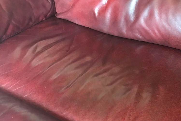 Second red leather sofa after repair