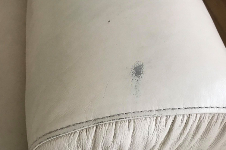 White leather sofa before repair